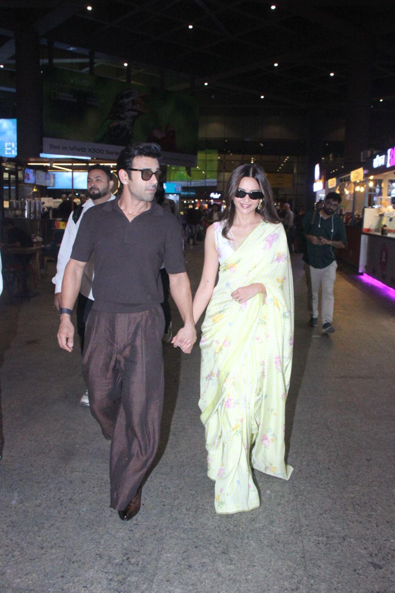 Pulkit Samrat and Kriti Kharbanda were spotted at the airport, turning heads effortlessly. Kriti stole the spotlight in a vibrant yellow chiffon saree.
